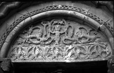The tympanum of the portal of the Church of Santa Maria Maggiore in Sovana (Sovana), Italy.