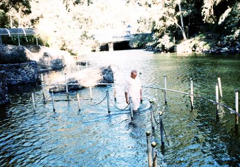 My baptism in the Jordan river.
In the background we see the dam that separates the river from the Side of the lake. In this place the river is quite wide, and after a few kilometers, it turns to a thin streamlet - all water is taken for the needs of water supply and irrigation.
